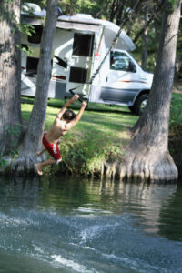 Kid Jumping into Water